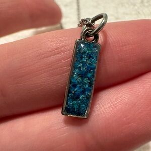 Necklace with small pressed blue flowers